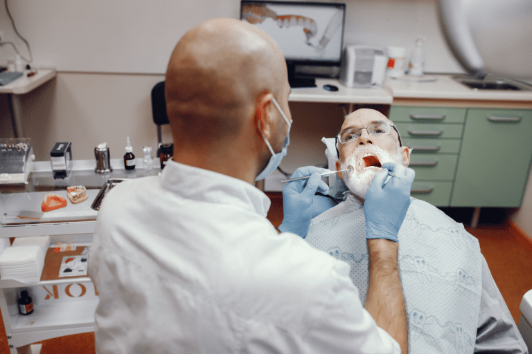 adult patient getting a dental implant in dentist clinic located in phoenix arizona