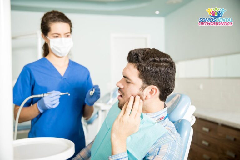 adult man suffering from toothache while looking dentist to know how to make braces stop hurting