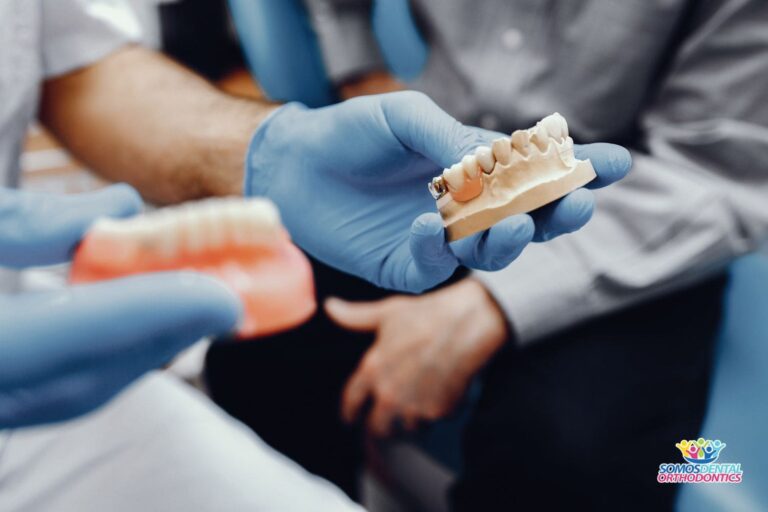 Artificial jaw of dental crowns in the dentist's office to explain how much does a dental crown cost