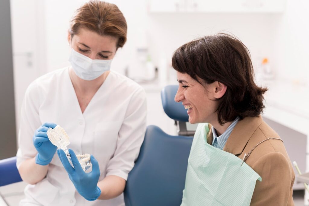 female patient looking for dental mold with an orthodontist to know how are dental crowns made