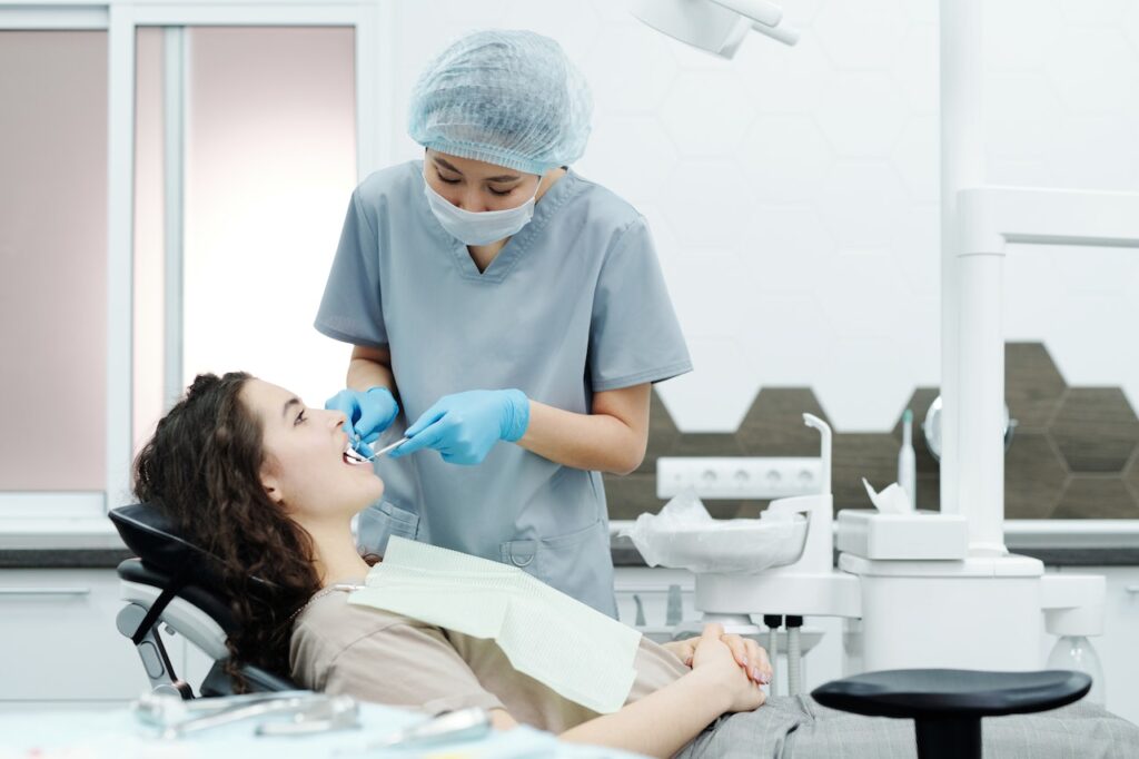 young woman getting a consultation with a female dentist in his clinic and knowing how much is a braces consultation