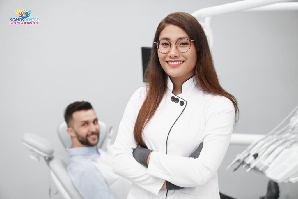 female-dentist-white-uniform-explaining-the-dental-crown-cost-in-dallas