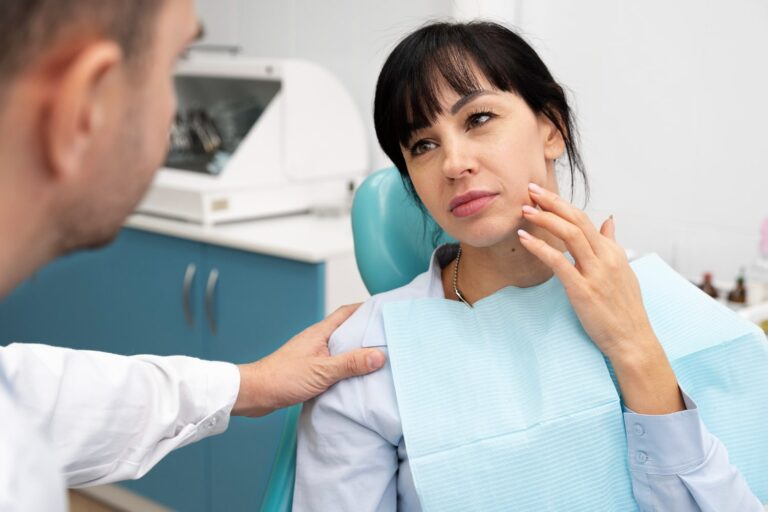 dentist doing check up patient explaining the benefits of removing wisdom teeth