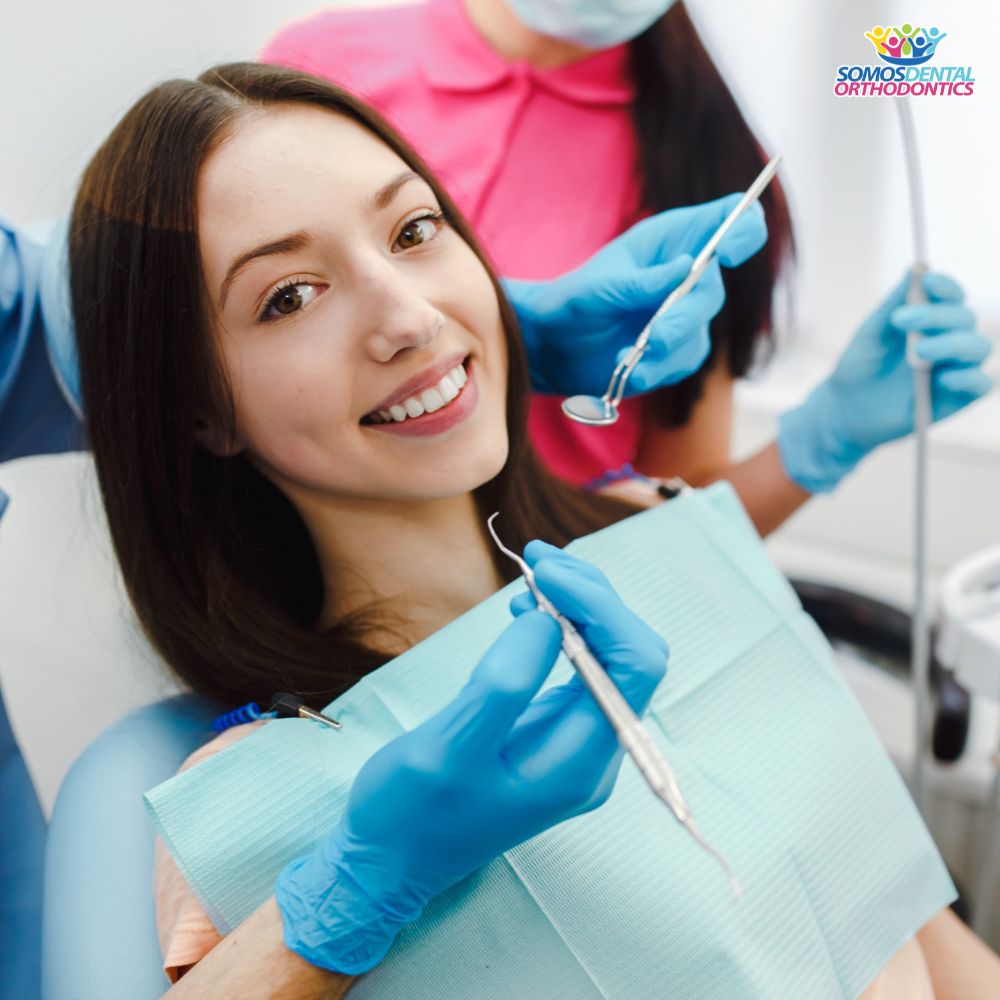 Smiling woman in dentist chair expecting a deep teeth cleaning in a dental clinic from Phoenix Arizona