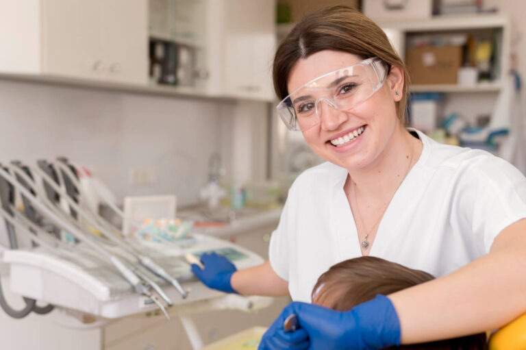 Dentist cleaning patient's teeth explaining how to get affordable braces without insurance