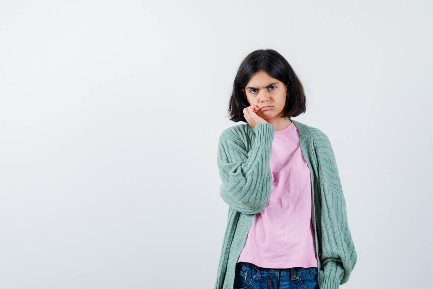 Expressive young girl posing in the studio