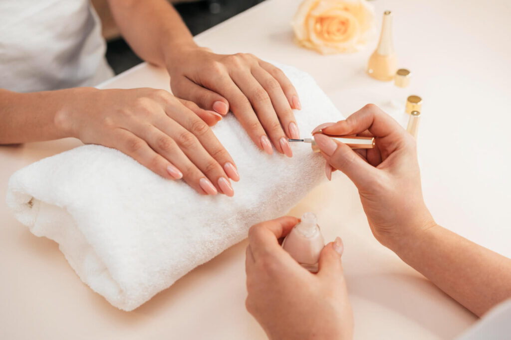 Healthy beautiful manicure and manicurist explaining rules before getting wisdom teeth out