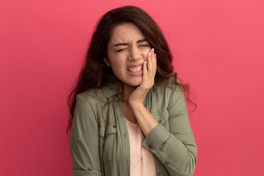 girl with tooth pain
