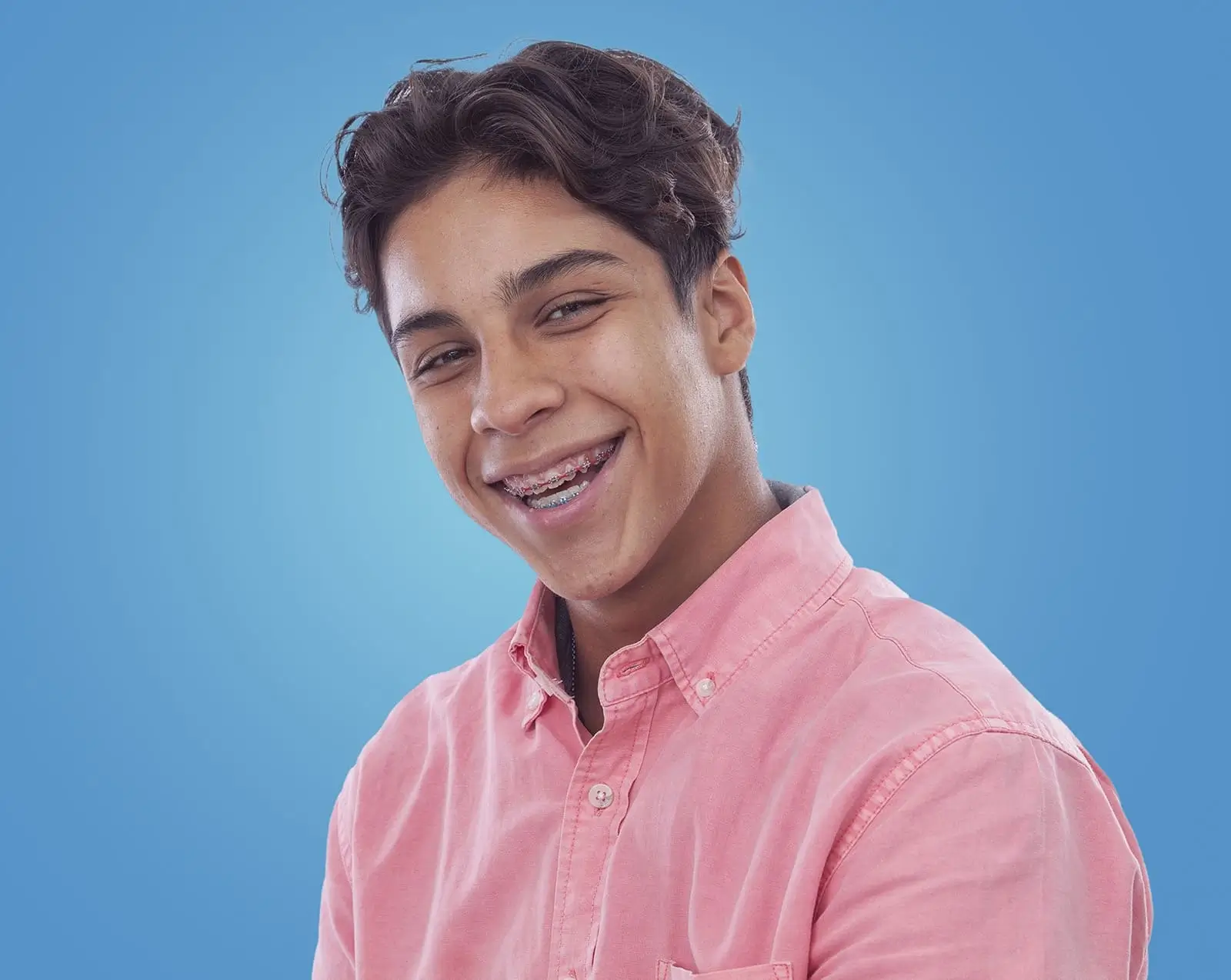 teenager boy smiling with braces