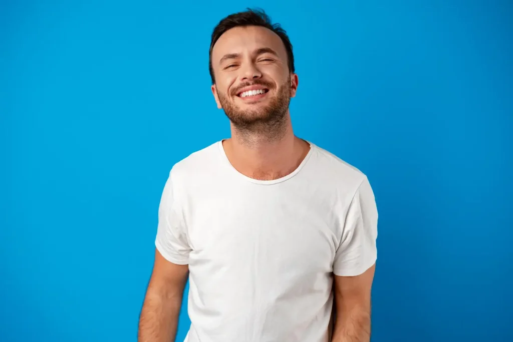 Happy-smiling-handsome-man-against-blue-background