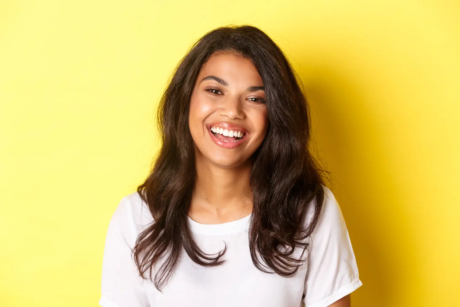 Close-up of joyful and beautiful african american woman laughing